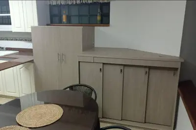 a kitchen with a table and a counter top at Casa Campestre Poblado para 10H San Lucas 106 in Medellín