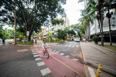 a person riding a bike in the street at Apartamento en el Estadio-Obelisco in Medellín
