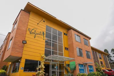 a building with a yellow at Hotel Valjala in Manizales