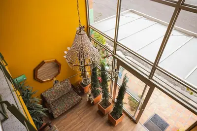 an overhead view of a living room with a chandelier at Hotel Valjala in Manizales