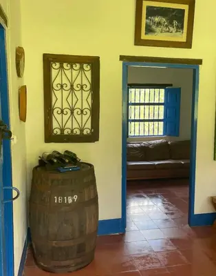 a room with a barrel and a window and a couch at Hacienda San Francisco in Venecia