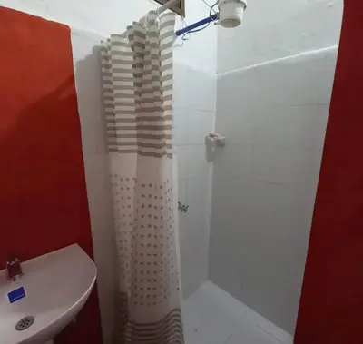 a bathroom with a shower and a toilet and a sink at Hacienda San Francisco in Venecia