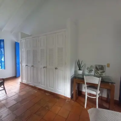a room with a desk and a table and a chair at Hacienda San Francisco in Venecia