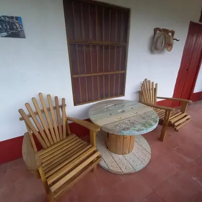 a room with two chairs and a table and a table and chairs at Hacienda San Francisco in Venecia