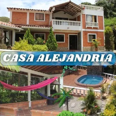 a house with a sign that reads casa alamedaenda at Casa Alejandria in Alejandría