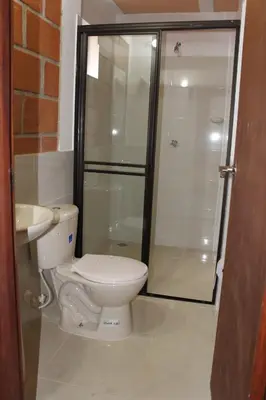a bathroom with a shower and a toilet and a sink at Casa Alejandria in Alejandría