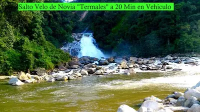 a waterfall in the middle of a river with rocks at Casa Alejandria in Alejandría