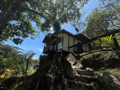 a tree house on top of a hill at Hostería El Sendero - Cocorná in Cocorná