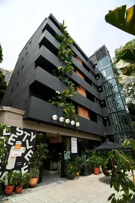 a building with plants on the side of it at The Somos Central Hotel Poblado in Medellín