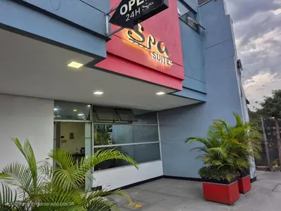 a sign on the side of a building at Hotel Spa Laureles in Medellín