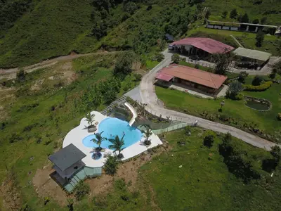an aerial view of a house with a swimming pool at Eco Hotel Samaria , Aguas y Bosques in San Rafael
