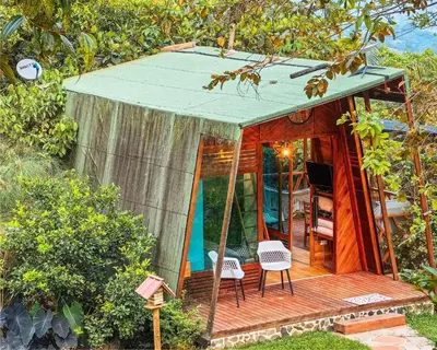 a tiny house with a deck with a tent at Eco Hotel Samaria , Aguas y Bosques in San Rafael