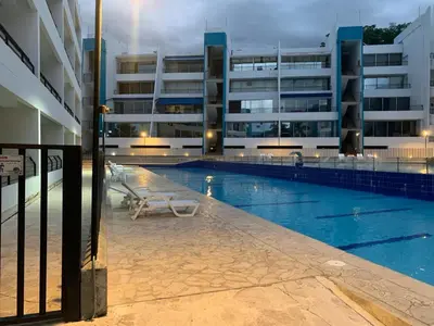 a large swimming pool in front of a building at Disfruta en Paraíso del Sol T9-402 in San Jerónimo