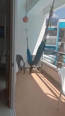 a hammock on the balcony of a cruise ship at Disfruta en Paraíso del Sol T9-402 in San Jerónimo