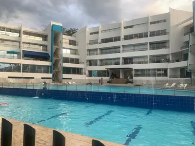 a swimming pool in front of a building at Disfruta en Paraíso del Sol T9-402 in San Jerónimo