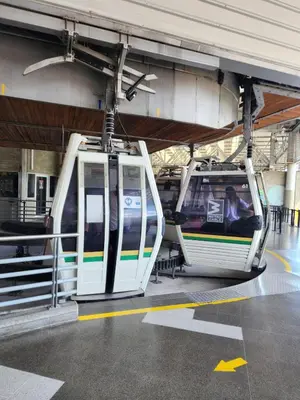 a subway train with its doors open at a station at apartamento loft a media cuadra de la estación floresta in Medellín