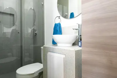 a bathroom with a sink and a toilet at Cozy New Loft in Laureles / Estadio! in Medellín