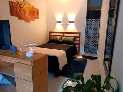 a small bedroom with a bed and a tv at OSIMiRI PLAZA Apartamento Naturaleza y aventura in San Rafael