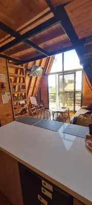 a room with a table and chairs in a room at Cabaña Starka & Jacuzzi in Marinilla