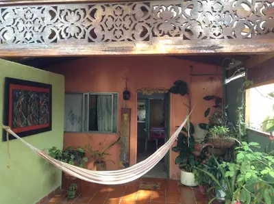 a hammock hanging in a room with plants at Apartamento-Galería de arte Cielo y Tierra in Medellín