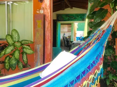 a colorful hammock in a room with at Apartamento-Galería de arte Cielo y Tierra in Medellín