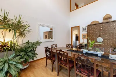 a dining room with a table and some plants at Double Master Provenza Penthouse, home gym&offices in Medellín