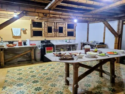 a kitchen with a table with food on it at LA MARQUESA PACORA in Pácora