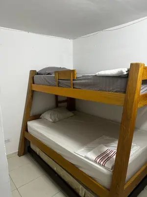 two bunk beds in a small room withthritisthritisthritisthritisthritisthritisthritisthritis at APARTAMENTO LAURELES ESTADIO NUEVO in Medellín
