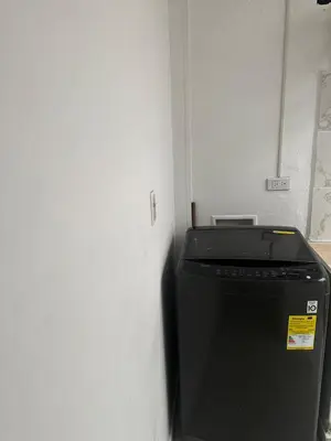 a trash can sitting next to a white wall at APARTAMENTO LAURELES ESTADIO NUEVO in Medellín