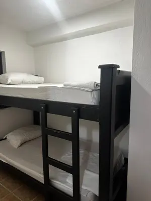 a black bunk bed in a small room at APARTAMENTO LAURELES ESTADIO NUEVO in Medellín