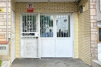 a front door of a house with white doors at Casa Laura in Medellín
