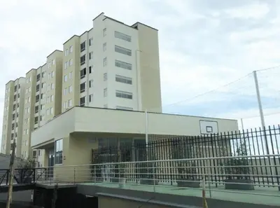 a tall building with a fence in front of it at Semi-loft Manizales Colombia in Manizales