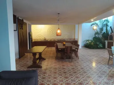 a dining room with a table and chairs and a dining room at Casa Amarilla in Honda