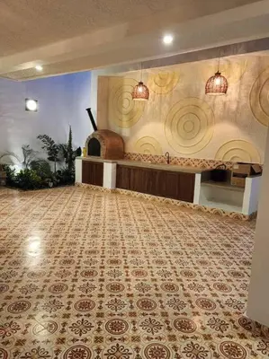 a large room with a large tile floor and a room with at Casa Amarilla in Honda