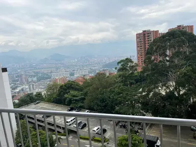 a view of a city from a balcony at Medellin parque lleras poblado palmas in Medellín