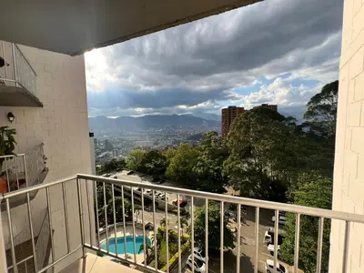 a balcony with a view of a city at Medellin parque lleras poblado palmas in Medellín