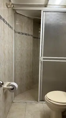 a bathroom with a shower and a toilet at Apartaestudio Cerca a los Molinos in Medellín