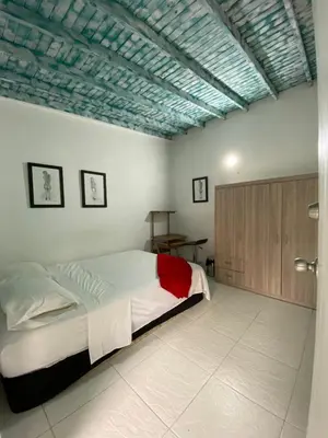 a bedroom with a large bed with a blue ceiling at Excelente apartamento Envigado - Full Equipamento. in Envigado