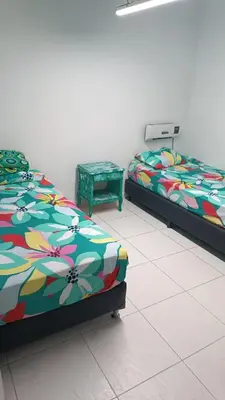 two beds sitting next to each other in a room at Excelente apartamento Envigado - Full Equipamento. in Envigado