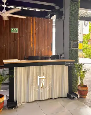 a reception desk in a building with a fence at Seven hotel in Santa Fe de Antioquia