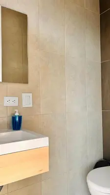 a bathroom with a white sink and a mirror at Seven hotel in Santa Fe de Antioquia