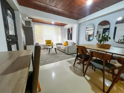 a living room with a dining room table and chairs at Cerca a provenza. Amplio. Con todo cerca 273 DG in Medellín