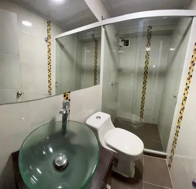 a bathroom with a glass sink and a toilet at Cerca a provenza. Amplio. Con todo cerca 273 DG in Medellín