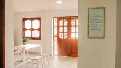 a dining room with a table and a table and chairs at OCASSO JARDIN APARTAMENTO AZULEJO in Jardin