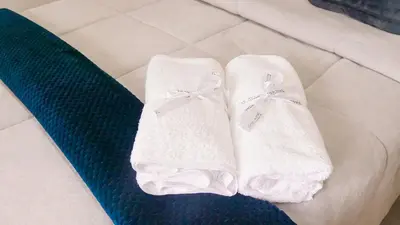 a pair of white socks sitting on a couch at OCASSO JARDIN APARTAMENTO AZULEJO in Jardin