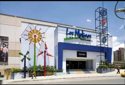 a rendering of a building with a windmill in front at Increíble Apartaestudio Cerca al Centro Comercial Los Molinos in Medellín