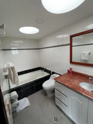 a bathroom with a tub and a toilet and a sink at Casa Campestre con terraza para 10 Poblado S Lucas 108 in Medellín