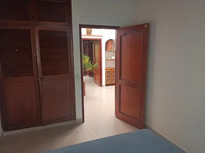 a room with an open door to a room with a hallway at Casa Campestre con terraza para 10 Poblado S Lucas 108 in Medellín
