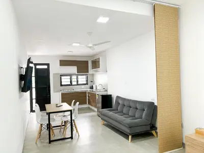 a living room with a couch and a table at Loft del Río Honda - Apartaestudio completo con parqueadero y aire acondicionado in Honda