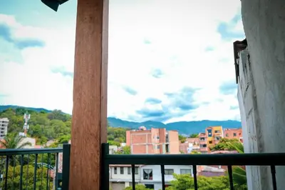 a view of a city from a balcony at Amplio duplex con terraza privada. in Medellín